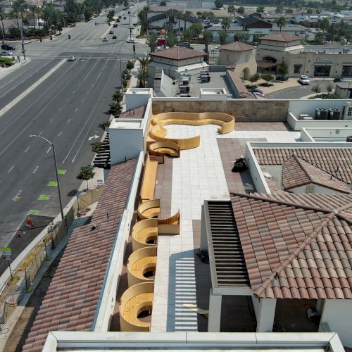 The image shows a rooftop with a large, decorative script resembling the 